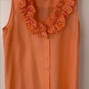 Beautiful blouse with raffles around the collar.